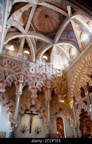 Double multifoil arches and dome ceiling of the Cathedral of Cordoba, inside the Great Mosque, Spain. Stock Photo