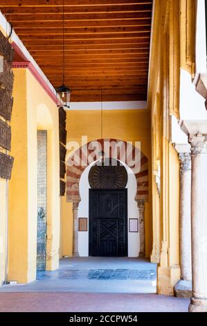 Alternating red and white voussoirs horseshoe arch at the Great Mosque of Cordoba in southern Spain. Stock Photo
