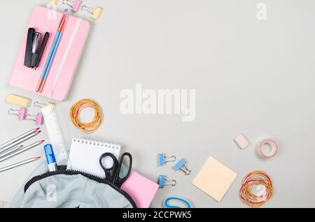 Different school supplies on light grey background Stock Photo
