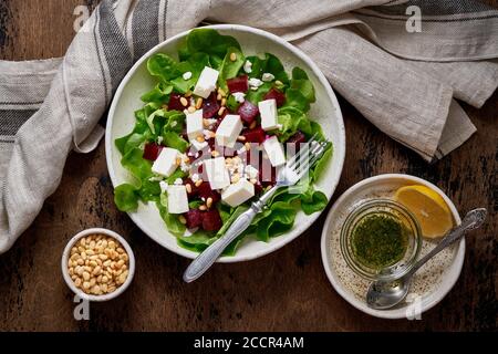 Healthy salad with beet, curd, feta and pine nuts, lettuce. Low carb keto ketogenic dash diet Stock Photo