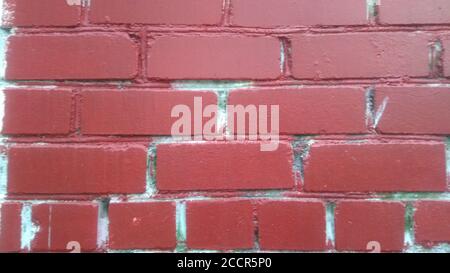 Background of brick wall texture painted into dark red Stock Photo