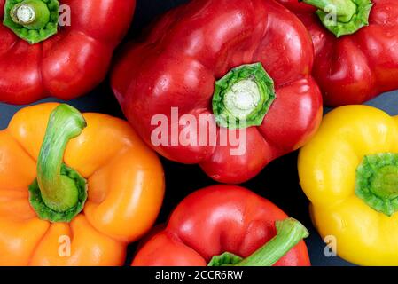 full-frame shot of red, orange and yellow bell peppers Stock Photo
