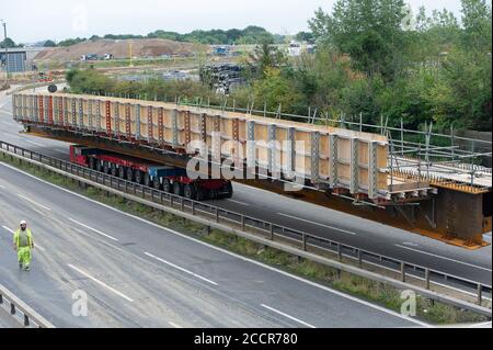 Taplow, Berkshire, UK. 15th August, 2020. The M4 was closed again this weekend between junctions 6 (Slough/Windsor) and Junction 8/9 (Maidenhead) for the installation of a new bridge  across the M4 at Lake End Road, Taplow. The hard shoulder between the M4 Junctions 3 and 12 will be converted into a traffic lane, however, the project remains controversial following the number of deaths on other UK Smart Motorways. Credit: Maureen McLean/Alamy Stock Photo