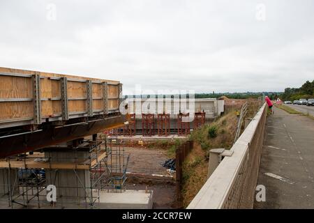 Taplow, Berkshire, UK. 15th August, 2020. The M4 was closed again this weekend between junctions 6 (Slough/Windsor) and Junction 8/9 (Maidenhead) for the installation of a new bridge  across the M4 at Lake End Road, Taplow. The hard shoulder between the M4 Junctions 3 and 12 will be converted into a traffic lane, however, the project remains controversial following the number of deaths on other UK Smart Motorways. Credit: Maureen McLean/Alamy Stock Photo