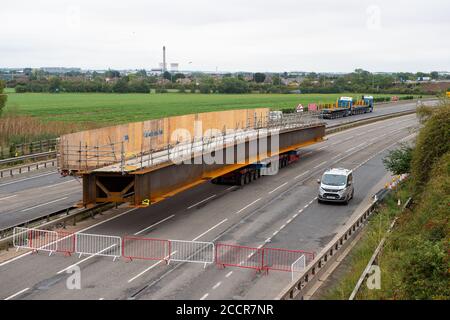 Taplow, Berkshire, UK. 15th August, 2020. The M4 was closed again this weekend between junctions 6 (Slough/Windsor) and Junction 8/9 (Maidenhead) for the installation of a new bridge  across the M4 at Lake End Road, Taplow. The hard shoulder between the M4 Junctions 3 and 12 will be converted into a traffic lane, however, the project remains controversial following the number of deaths on other UK Smart Motorways. Credit: Maureen McLean/Alamy Stock Photo