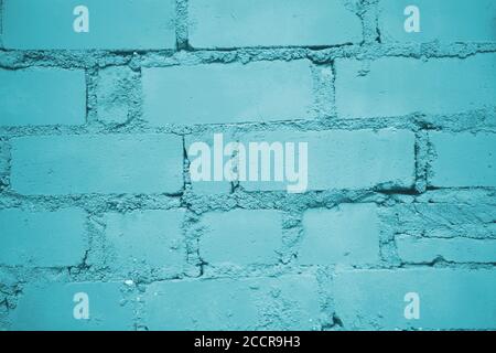 Painted into teal green Brick wall background closeup Stock Photo