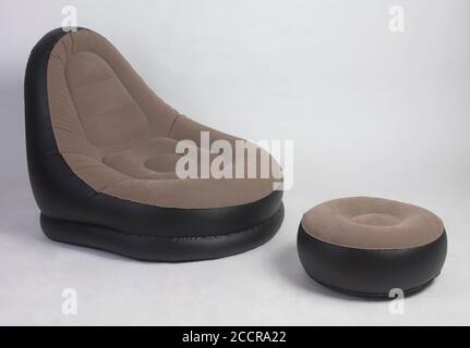 Inflatable brown color chair and stool isolated on white background Stock Photo