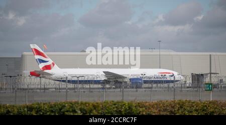 Heathrow Airport, London, UK. 24 August 2020. Tailfin of British Airways Boeing 777 aircraft parked at Heathrow airport. Credit: Malcolm Park/Alamy. Stock Photo
