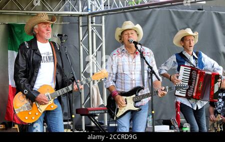 Hatfield, UK. 23rd Aug, 2020. Paul Young, Jamie Moses and Matt Irving of Los Pacaminos Musical group perform live on stage at Hatfield Park. Credit: SOPA Images Limited/Alamy Live News Stock Photo