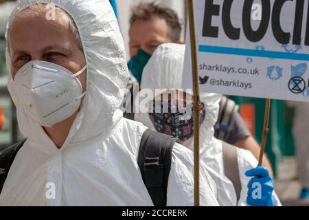 London, UK. 24th August 2020. Extinction Rebellion members protest outside Barclays Bank in Balham, South London. XR continue their ’Sharklays’ campaign, investigating Barclays Bank for crimes against humanity and the planet. XR state that Barclays is now the biggest European investor in fossil fuels. Credit: Neil Atkinson/Alamy Live News Stock Photo