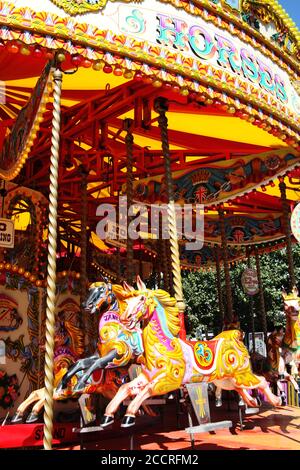 Carousel merry go round child carnival fairground horses at an amusement park stock photo image Stock Photo