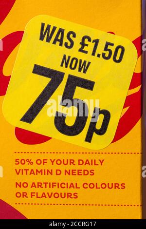 Was £1.50 now 75p reduced sticker half price sticker on box of Kelloggs Honey Loops breakfast cereal - reduced food yellow sticker Stock Photo