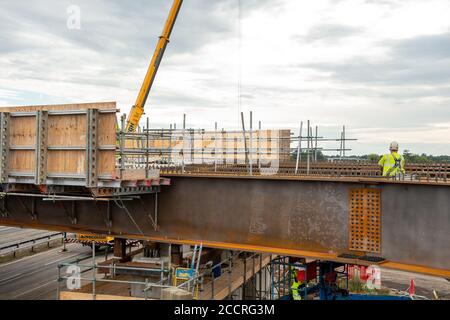 Taplow, Berkshire, UK - 16th August, 2020. The M4 was closed again this weekend between junctions 6 (Slough/Windsor) and Junction 8/9 (Maidenhead) as the final part of a new bridge across the M4 was installed. The hard shoulder between the M4 Junctions 3 and 12 will be converted into a traffic lane, however, the project remains controversial following the number of deaths on other UK Smart Motorways. Credit: Maureen McLean/Alamy Stock Photo