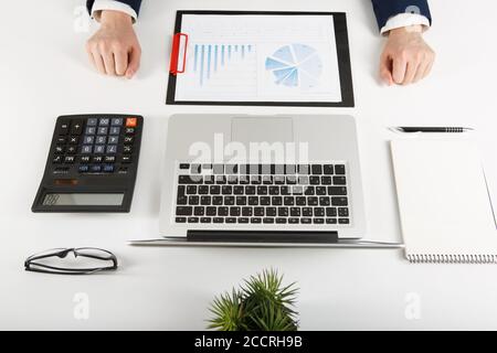 Overhead view of businessman working at computer Stock Photo