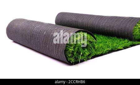 artificial green grass, coated roll isolated on white background, lawn. Stock Photo