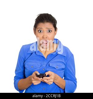 Closeup portrait of young, shocked business woman talking on cell phone seeing bad text message, email, isolated on white background. Negative emotion Stock Photo