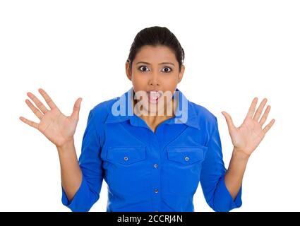 Closeup portrait of surprised, shocked young woman hands in air looking at you, isolated white background. Negative emotions, facial expressions, feel Stock Photo