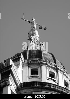 Monochrome image of the Scales of Justice of the Central Criminal Court fondly known as the Old Bailey London England, UK the main block dates from 19 Stock Photo