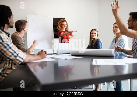 Group of diverse designers, business people brainstorming on meeting in office Stock Photo