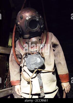 Old vintage antique deep sea diving suit with a brass helmet stock photo image Stock Photo