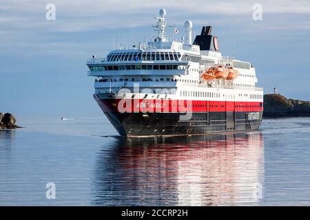 Svolvaer, Lofoten Islands, Norway, august 10 2014; Hurtigruten ('Express Route', also known as the Norwegian Coastal Express) here captured entering S Stock Photo