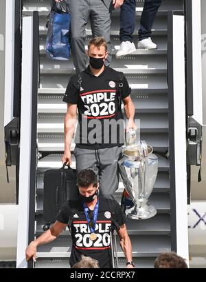 Munich, Germany. 24th Aug, 2020. FC Bayern Munich's team arrives at Munich Airport after their Champions League victory over PSG and goalkeeper Manuel Neuer (above) with the cup and Robert Lewandowski leave the plane. Credit: Peter Kneffel/dpa Pool/dpa/Alamy Live News Stock Photo