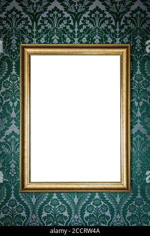 blank golden picture frame hanging on wall on green floral vintage wallpaper Stock Photo