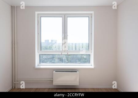 New tubes, radiator and window. Close up image, renovation concept Stock Photo