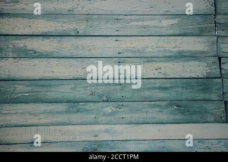 old wooden weathered planks painted into green with horizontal boards Stock Photo