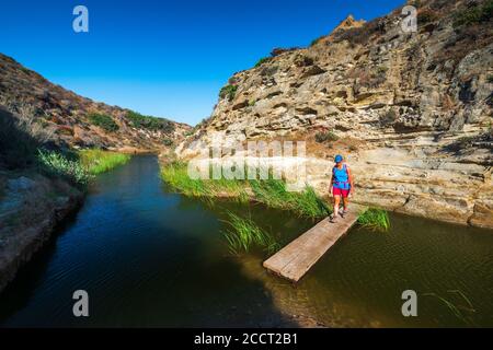 Hiker in Water Canyon, Santa Rosa Island, Channel Islands National Park, California USA Stock Photo