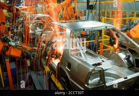 Sparks flying from spot welding robotics in Scania auto plant in Sweden Stock Photo