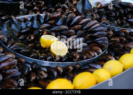 Turkish delicious rice stuffed mussels also known as midey dolma as Turkish with lemon slices Stock Photo