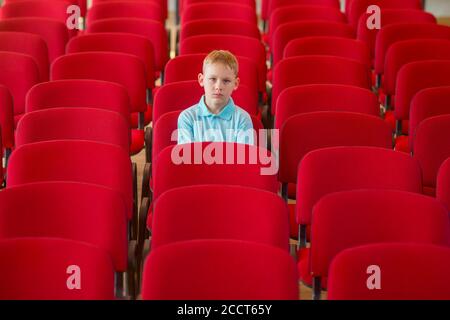 School kid at lesson and event. Safe back to school during pandemic concept. Social distancing to fight COVID-19 Stock Photo