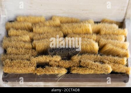 Clean paint brushes in wooden box background top view, selective focus Stock Photo