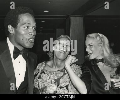 Los Angeles.CA.USA.  LIBRARY. O. J. Simpson and Nicole Brown Simpson with Dionne Warwick at the St. Jude's and Children's Research hospital at Century Plaza Hotel. 11th July 1980.  The couple began dating in 1979. Married in 1985 . Divorced 1992. Brown Simpson was murdered 12th June 1994. O.J. Simpson was tried for her murder but acquitted.   UPDATED:12.08.2020 Ref:LMK30-SLIB120820PBOR-001 Peter Borsari/PIP-Landmark MediaWWW.LMKMEDIA.COM.