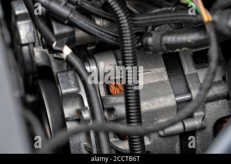 Detail of the alternator of a modern car engine. Stock Photo