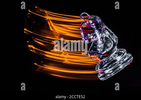 Chess pieces moving with color efects from different lights Stock Photo