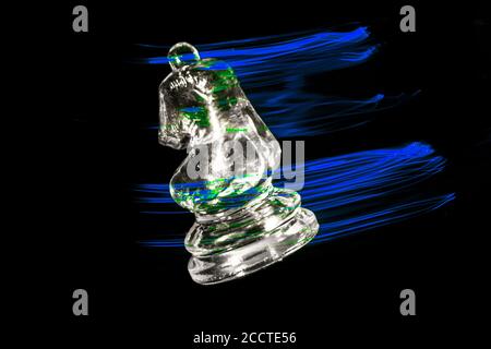 Chess pieces moving with color efects from different lights Stock Photo