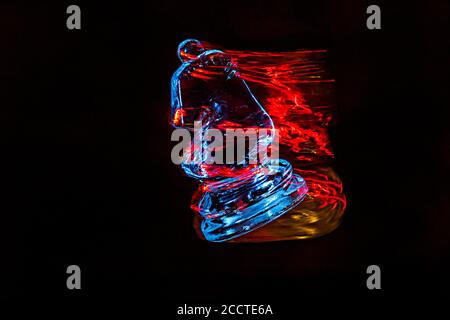 Chess pieces moving with color efects from different lights Stock Photo