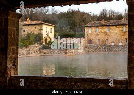 In the center of Bagno Vignoni dominates the old thermal pool. Today the pool is a protected monument and bathing is forbidden here. But the charm of the old bathing place is perfectly preserved. Several cafes and restaurants line the historic site, which has often been the backdrop for films. Stock Photo