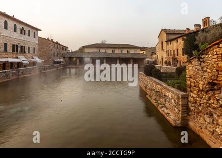 In the center of Bagno Vignoni dominates the old thermal pool. Today the pool is a protected monument and bathing is forbidden here. But the charm of the old bathing place is perfectly preserved. Several cafes and restaurants line the historic site, which has often been the backdrop for films. Stock Photo