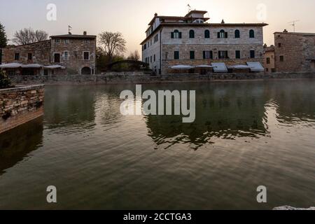 In the center of Bagno Vignoni dominates the old thermal pool. Today the pool is a protected monument and bathing is forbidden here. But the charm of the old bathing place is perfectly preserved. Several cafes and restaurants line the historic site, which has often been the backdrop for films. Stock Photo