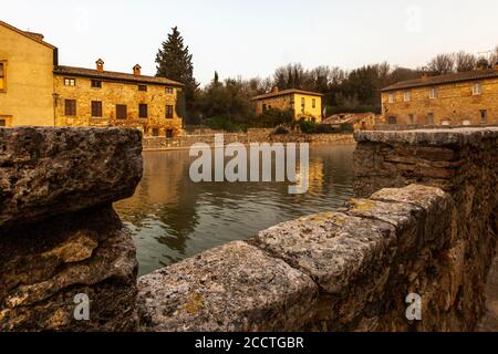 In the center of Bagno Vignoni dominates the old thermal pool. Today the pool is a protected monument and bathing is forbidden here. But the charm of the old bathing place is perfectly preserved. Several cafes and restaurants line the historic site, which has often been the backdrop for films. Stock Photo