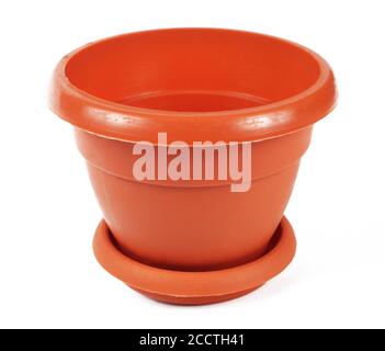 Empty brown plastic flower pot on white background, isolate, close-up Stock Photo