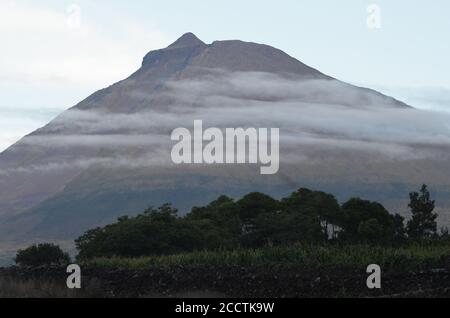 The conical Pico volcano looming over its namesake island (Azores archipelago, Portugal) Stock Photo