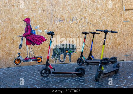 Rome, Italy, August 24th, 2020. Street art by Rome artist Maupal depicts Little Red Riding Hood on a rental scooter, while the Roman she wolf slinks off with a Dutch tulip in its jaws, depicting the agreement reached with the EU after Holland conceded to a post Covid recovery fund for Italy. Credit: Stephen Bisgrove/Alamy Live News Stock Photo