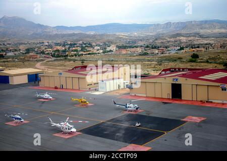 View from the air of the heliport of Alicante Spain with several helicopters and aircraft hangars Stock Photo