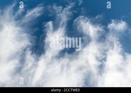 Beautiful view of white fluffy clouds in blue sky. Summer natural weather background Stock Photo