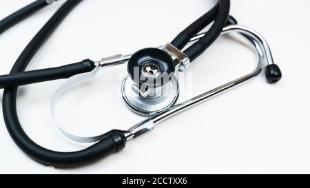 Black Stethoscope or phonendoscope on the white background isolated on white close up, Medical concept.  Stock Photo