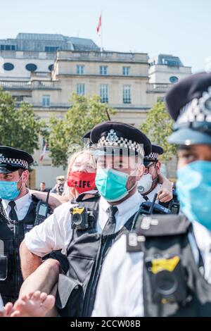 Extinction Rebellion taint the fountains at Trafalgar Square for their Blood On Your Hands Stock Photo